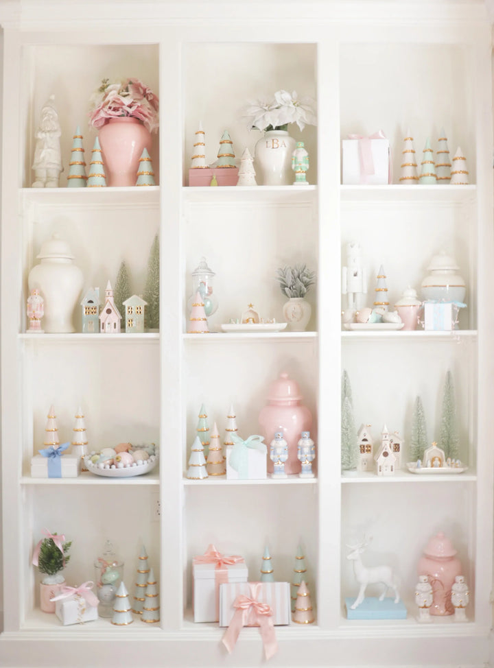 White shelves with decorative items including vases, figurines, and small boxes.